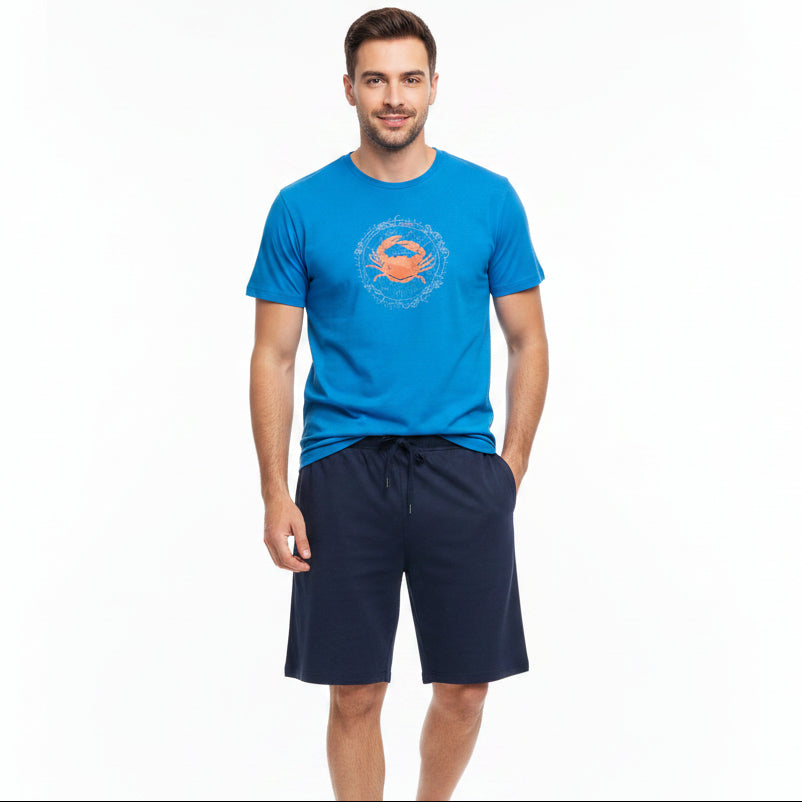 Blue tee with an orange crab graphic and navy shorts