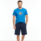 Blue tee with an orange crab graphic and navy shorts