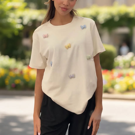 Cream oversized t-shirt with small pastel gingham bows stitched across the front