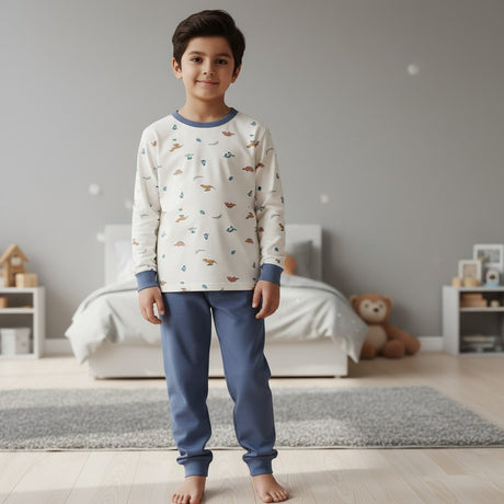 Boy in a cream dinosaur print pyjama top with blue pants, Jack Gifts Online Lebanon
