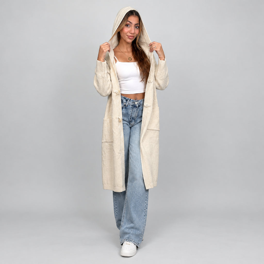 Full length cream hooded cardigan worn with the hood up