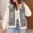 Washed denim jacket with cream rib knit sleeves, rhinestone chest pockets and a white drawstring hood, worn with jeans
