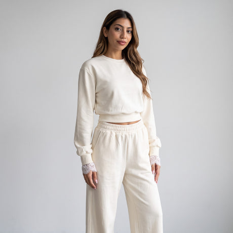 Full length cream set against a pale wall