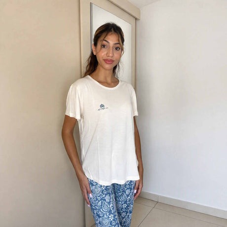 Ivory short sleeve sleepwear top with a small embroidered chest motif