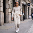 Cream rhinestone studded jogging set worn walking on a city street