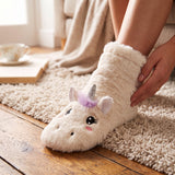 Cream plush unicorn slipper sock with a glitter horn, felt ears and lilac mane
