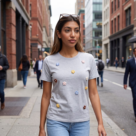 Grey crochet flower tee worn with jeans on a busy pavement