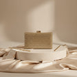 Gold crystal covered box clutch with clasp closure