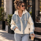 Light blue crystal denim hoodie jacket with cream knit sleeves and rhinestone pockets, worn with jeans on a city street