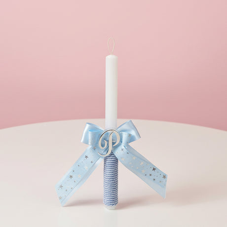Straight candle with a blue star ribbon bow, wrapped grip and gold letter