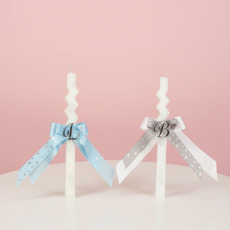 Zigzag candles with light blue and silver star ribbon bows and gold letters