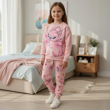 Girl wearing a pink Angel character sweatshirt and matching joggers with an all over hearts print