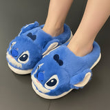 Cobalt Stitch mules in short velvety plush, worn on a dark tiled floor
