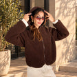 Dark brown sherpa fleece zip jacket with the hood up