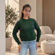 Dark green textured knit crew neck sweater worn with light jeans
