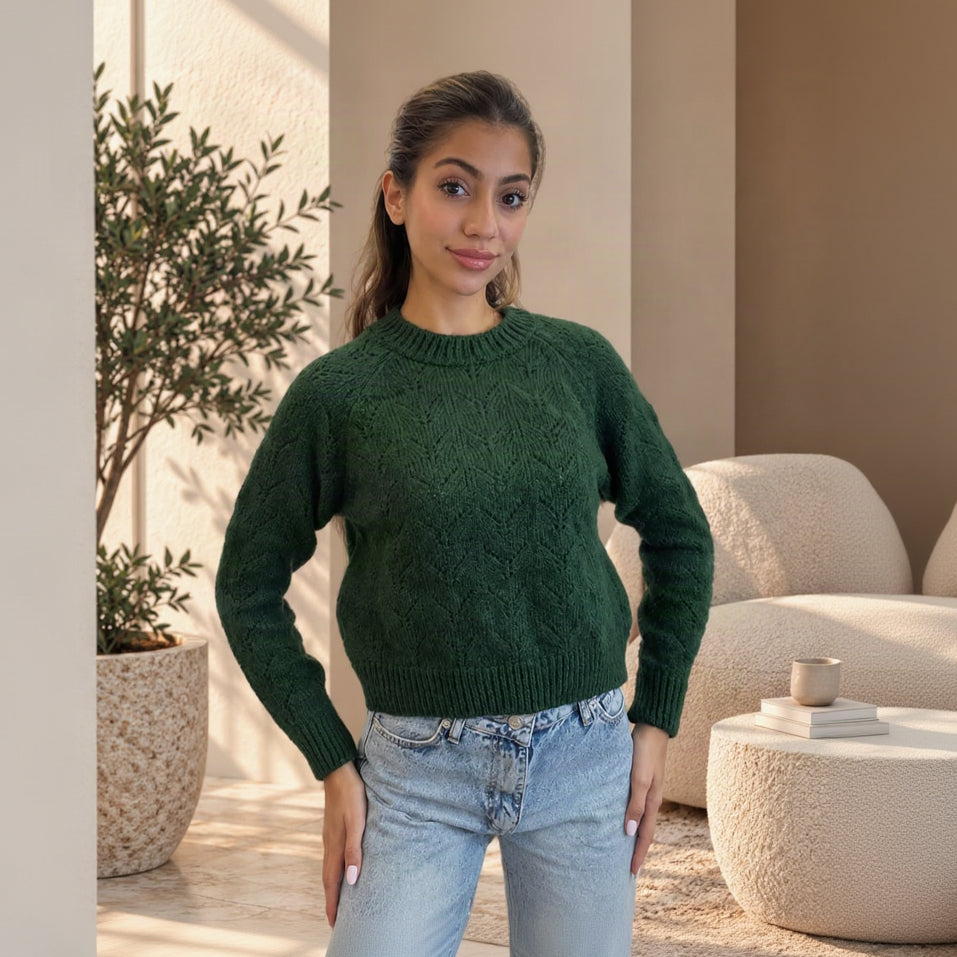 Dark green textured knit crew neck sweater worn with light jeans