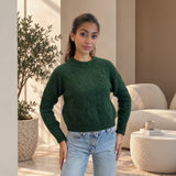 Dark green textured knit crew neck sweater worn with light jeans