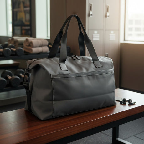 Dark grey weekender gym bag with front zip pocket and shoulder strap