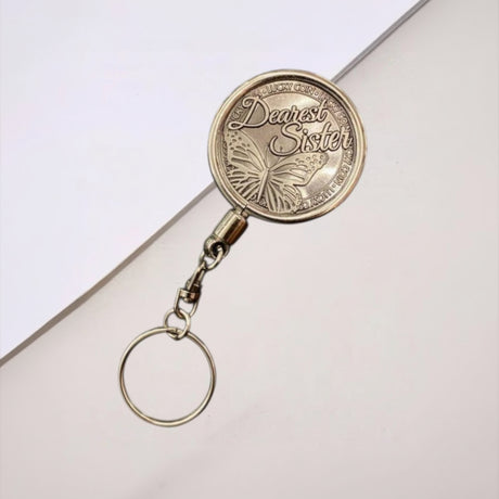 Dearest Sister engraved coin keychain with butterfly design