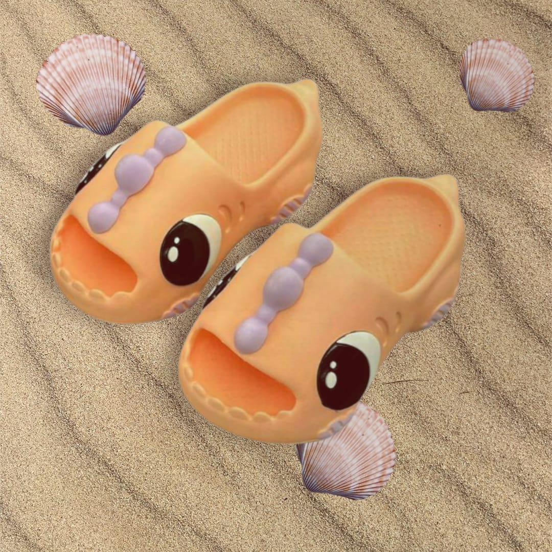 Peach dinosaur slides with lilac ridge strap and big moulded eyes
