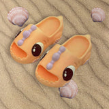 Peach dinosaur slides with lilac ridge strap and big moulded eyes
