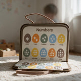 Numbers page with ten coloured dinosaur eggs from one to ten and matching number pieces