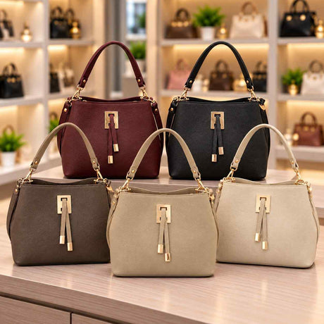 Five bucket bags in burgundy, black, grey, beige and cream with gold clasps and double tab fronts