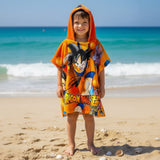 Boy wearing an orange Dragon Ball hooded poncho towel with the hood up on the beach