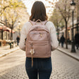 Dusty pink pebbled leather backpack with woven flower charm, Jack Gifts Online Lebanon