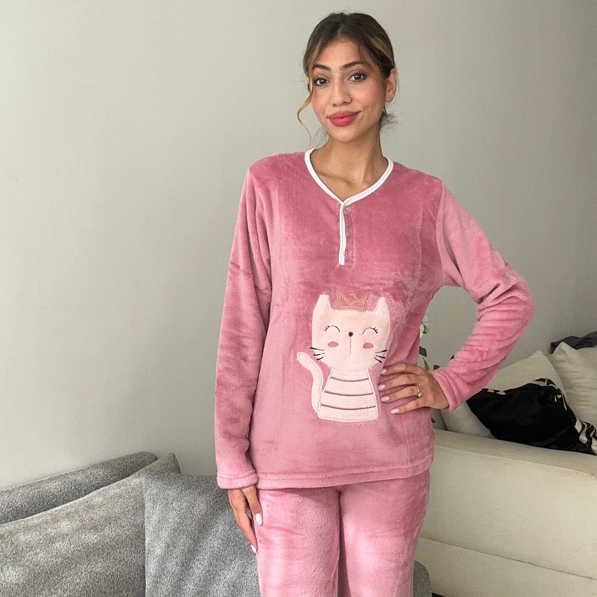Dusty rose pyjama top shown from the front with the cat applique at the waist