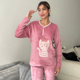 Dusty rose fleece pyjama set worn with a raised hand showing the sleeve length
