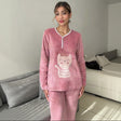 Dusty rose fleece pyjama set with a cream crown cat applique and white piping