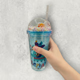 Ice blue crackled ice tumbler printed with a folk art elephant and a bird