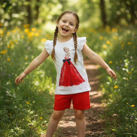 Girl outdoors wearing a red and white Elsa princess set with a frilled sleeve top