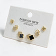 Gold tone clover stud set with polished crosses, pave flower outlines and black enamel clovers