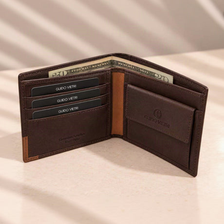 Tan corner trim and a press stud coin purse on an espresso brown bifold, notes behind