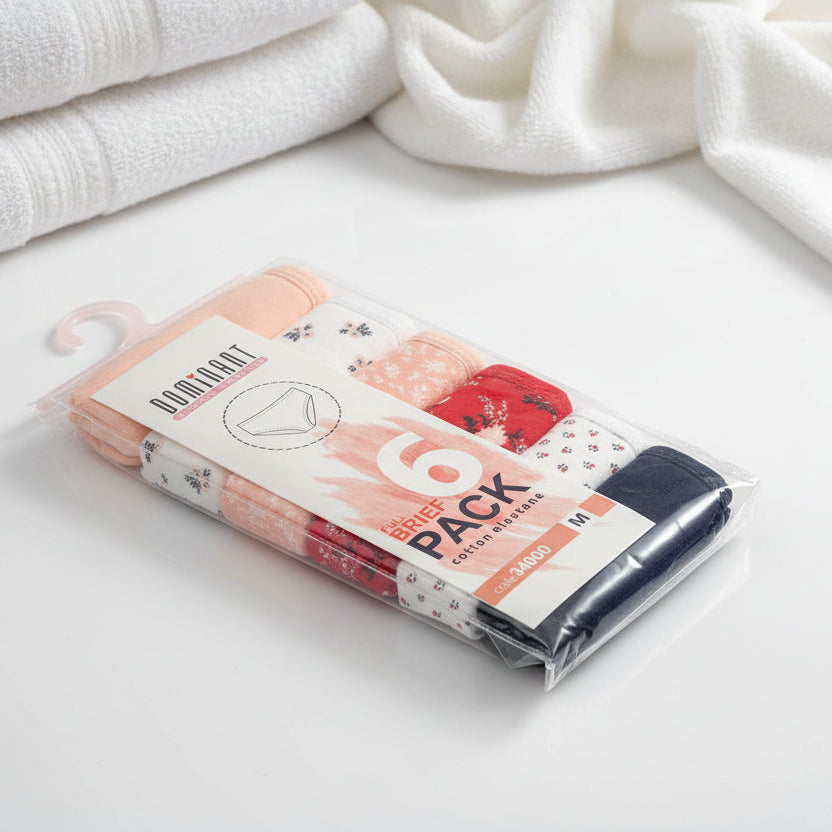 Clear six pack box of mixed print briefs with a navy pair at the front