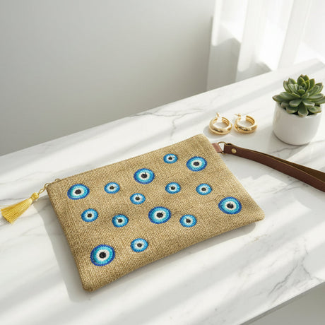 Jute zip pouch scattered all over with small embroidered evil eyes in blue and white
