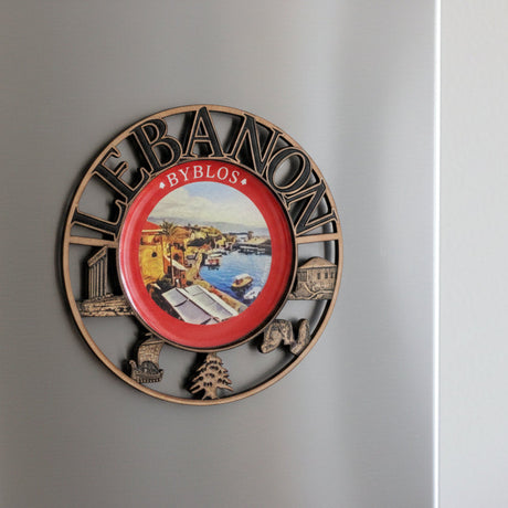 Copper medallion magnet ringed with landmarks around a view of the Byblos harbour