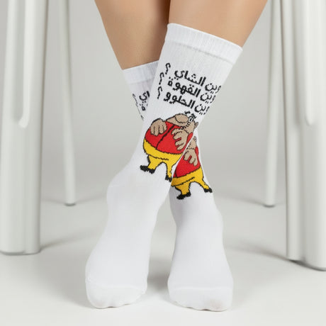 Fat Guy cartoon crew socks worn on both feet against a pale backdrop