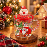 Clear glass mug with a Santa in the chimney print and a red Santa head lid