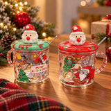 Two clear glass Santa mugs with red and green Santa head lids and striped handles