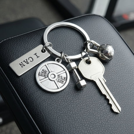 Fitness keychain with weight plate, dumbbell, kettlebell, and an I Can tag