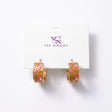 Coral and olive floral enamel hoop earrings with small clear crystals on a card