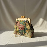 Front view of floral handbag showing flower stitch detail