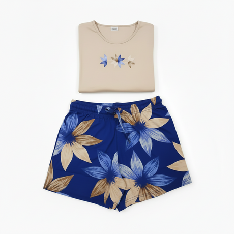 Beige shirt with floral design and blue floral skirt on a white background