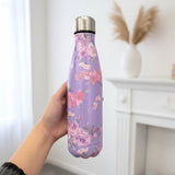 Lilac vacuum flask with watercolour pink roses held in a bright room