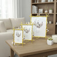 Three gold twig frames with lilac blossoms in relief, sized small, medium and large