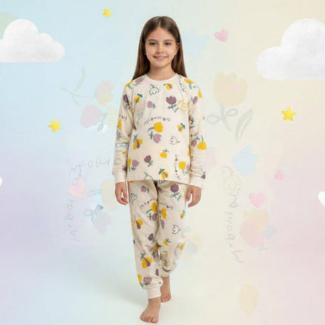 Girls cream pajama set with a pastel flower print and cuffed pants