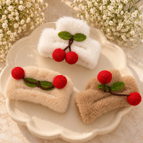 Three fluffy claw clips in white, beige and camel with red felt cherries and green leaves